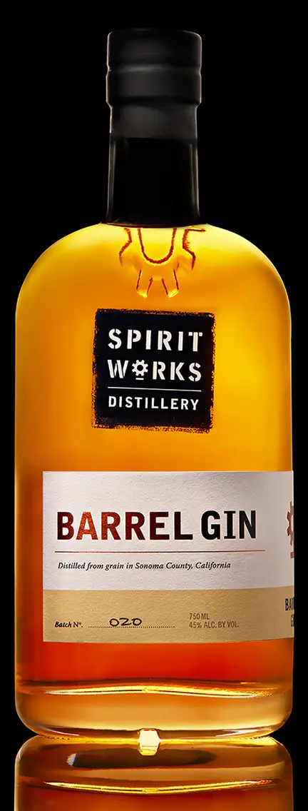 An elegant bottle shot of a local Sonoma Valley Barrel gin against a black background. The photo was shot at Ryan Smith's photography studio.
